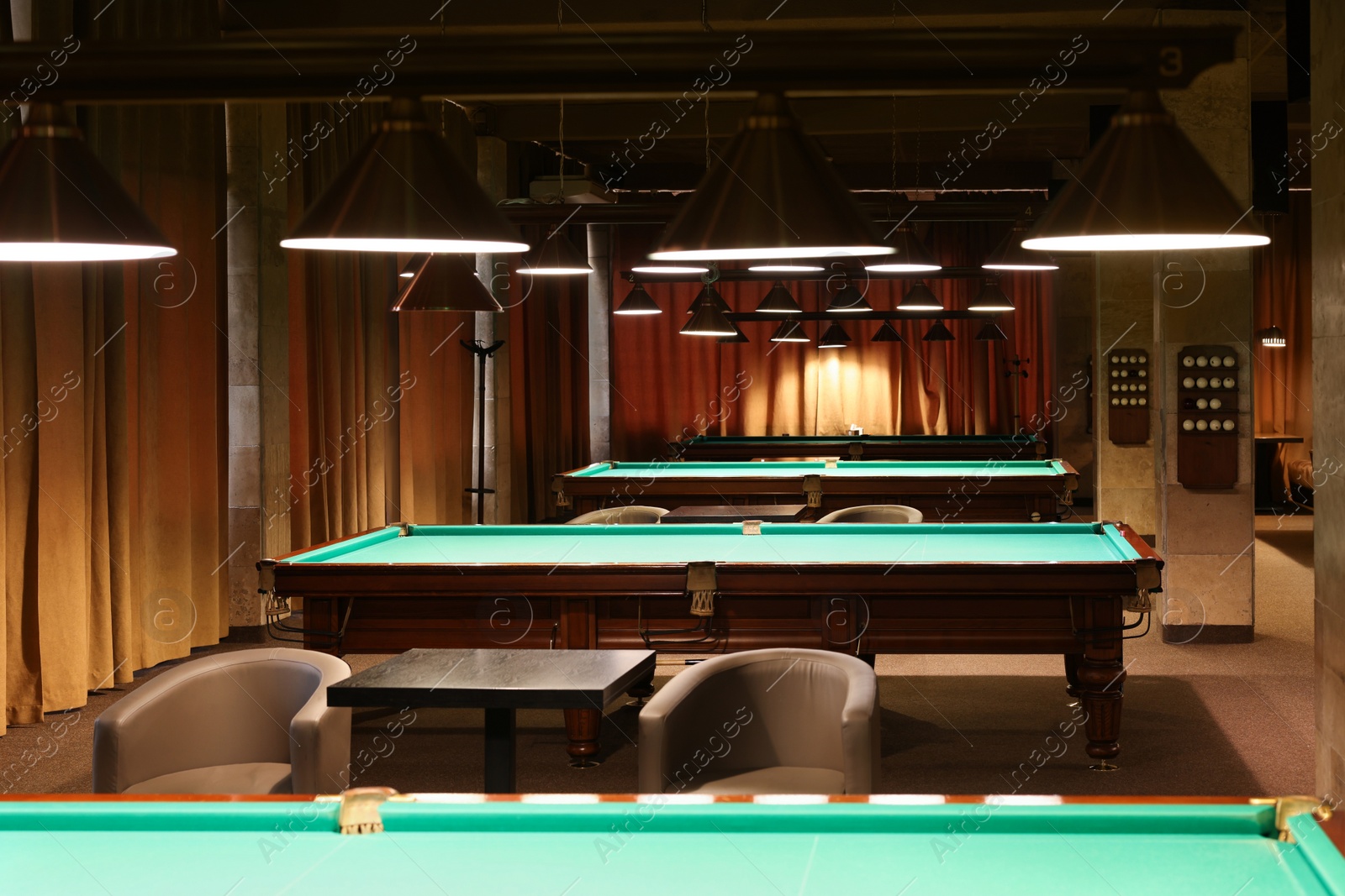 Photo of Empty green billiard tables in club. Pool Game