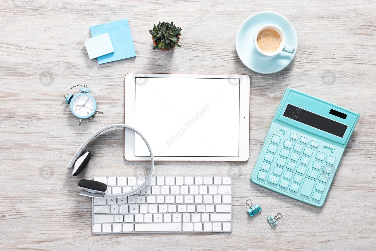 Photo of Flat lay composition with modern tablet on white wooden table. Space for text