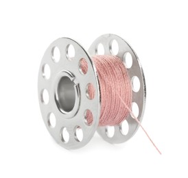 Photo of Metal spool of pink sewing thread isolated on white