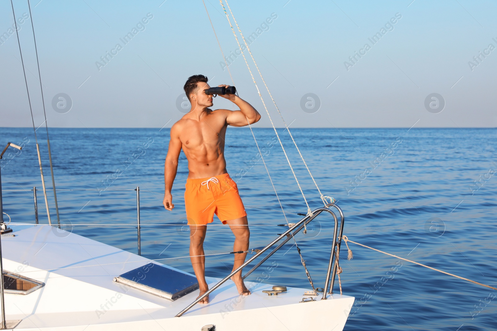 Photo of Young man relaxing on yacht during sea trip