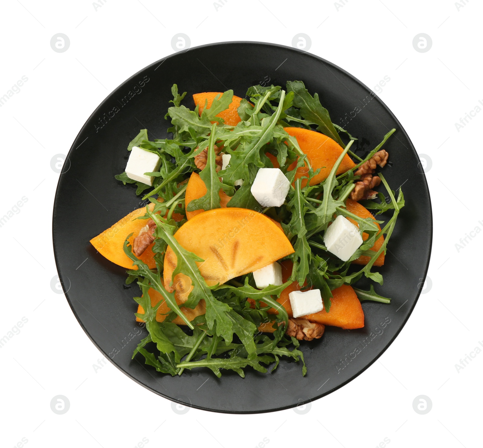 Photo of Delicious persimmon salad with feta cheese and arugula isolated on white, top view