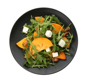 Delicious persimmon salad with feta cheese and arugula isolated on white, top view