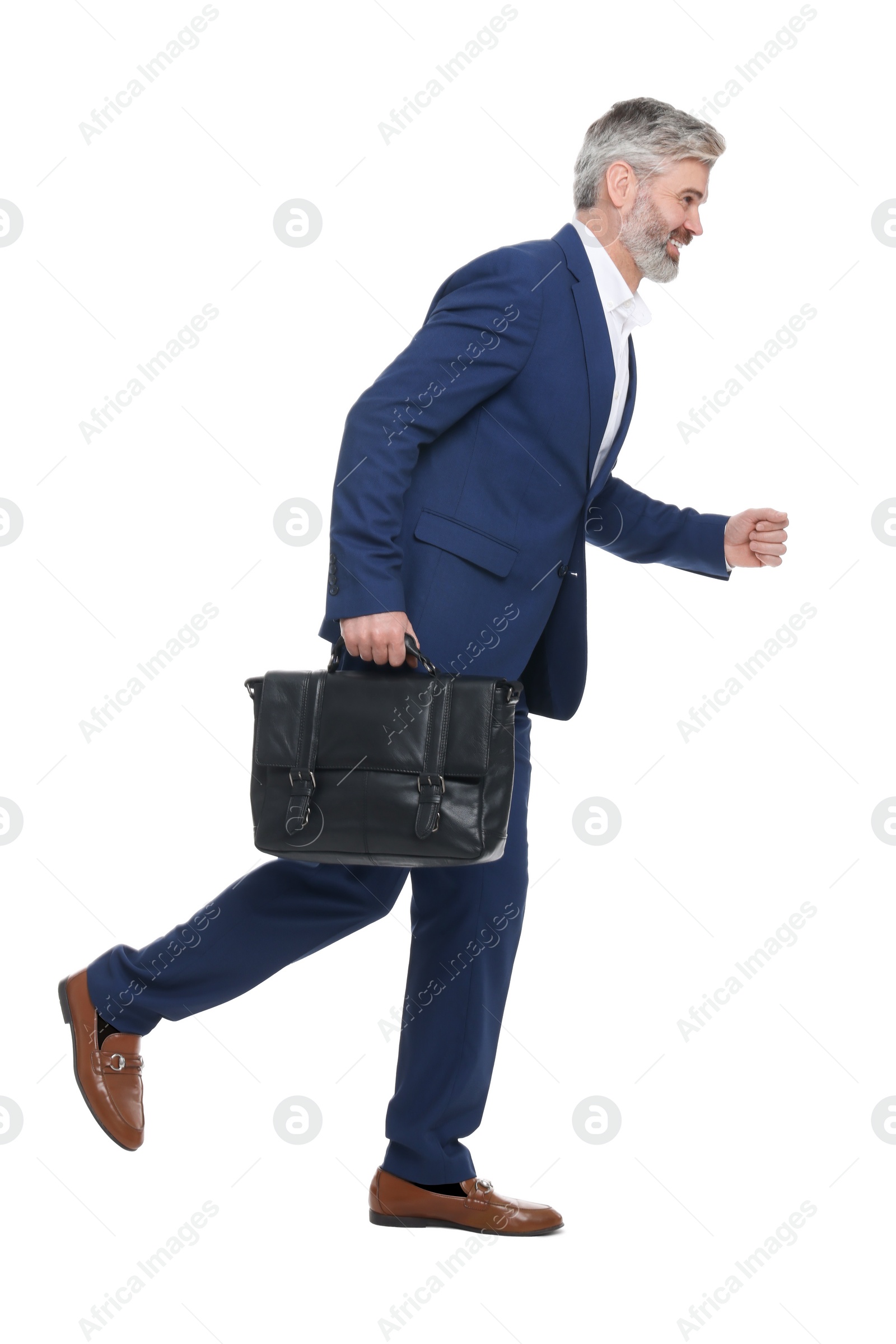 Photo of Mature businessman with briefcase walking on white background