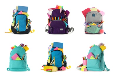 Set of backpacks with bright school stationery on white background 