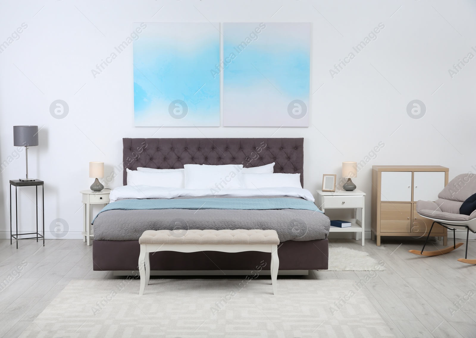 Photo of Stylish room interior with large comfortable bed