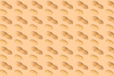 Image of Many peanuts on beige background. Food pattern