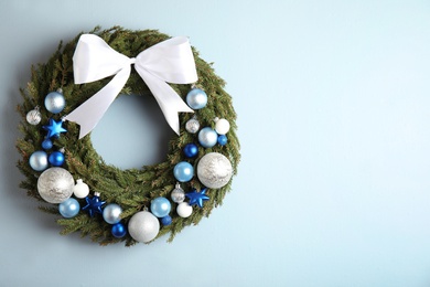 Beautiful Christmas wreath on light background, top view. Space for text