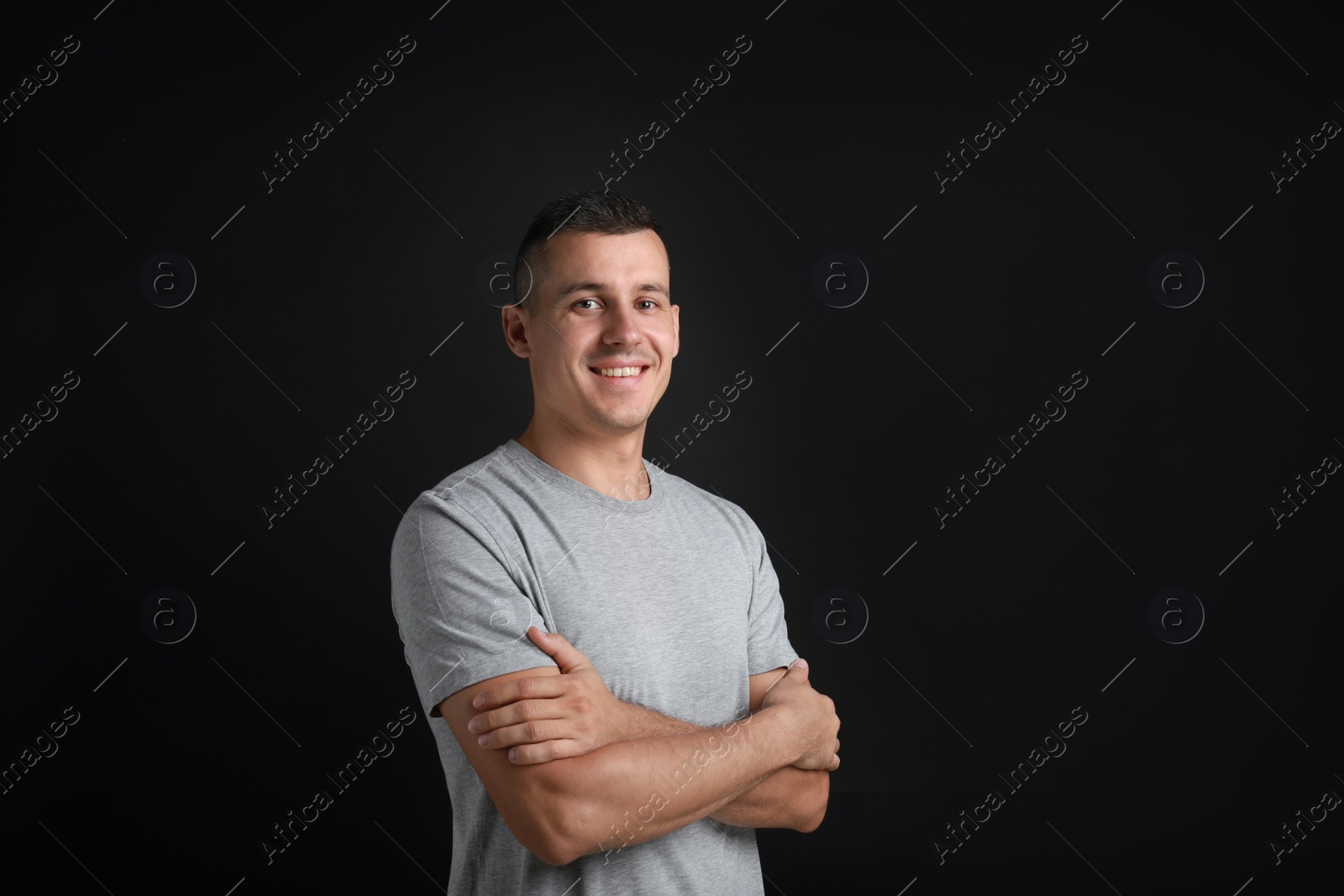 Photo of Portrait of handsome man on black background