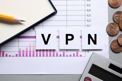 Photo of Flat lay composition of paper notes with acronym VPN (Virtual Private Network) and document on light grey background