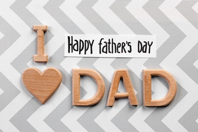 Photo of Phrase "I love dad" on color background. Father's day celebration