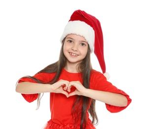 Cute little child in Santa hat posing on white background. Christmas celebration