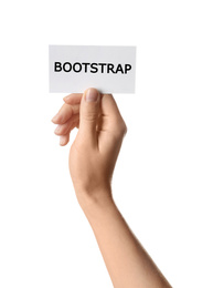 Image of Woman holding card with word BOOTSTRAP on white background, closeup