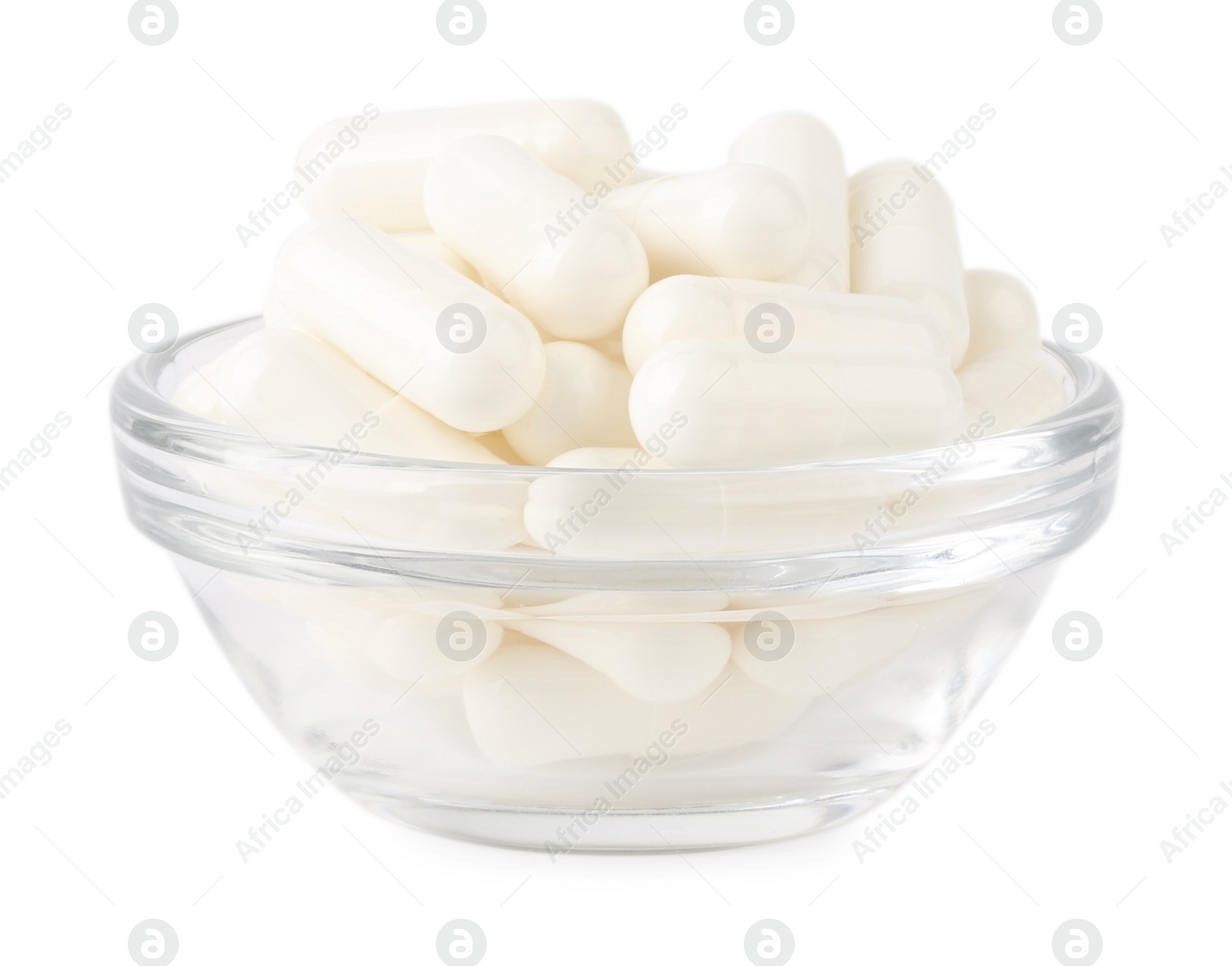 Photo of Vitamin capsules in glass bowl isolated on white