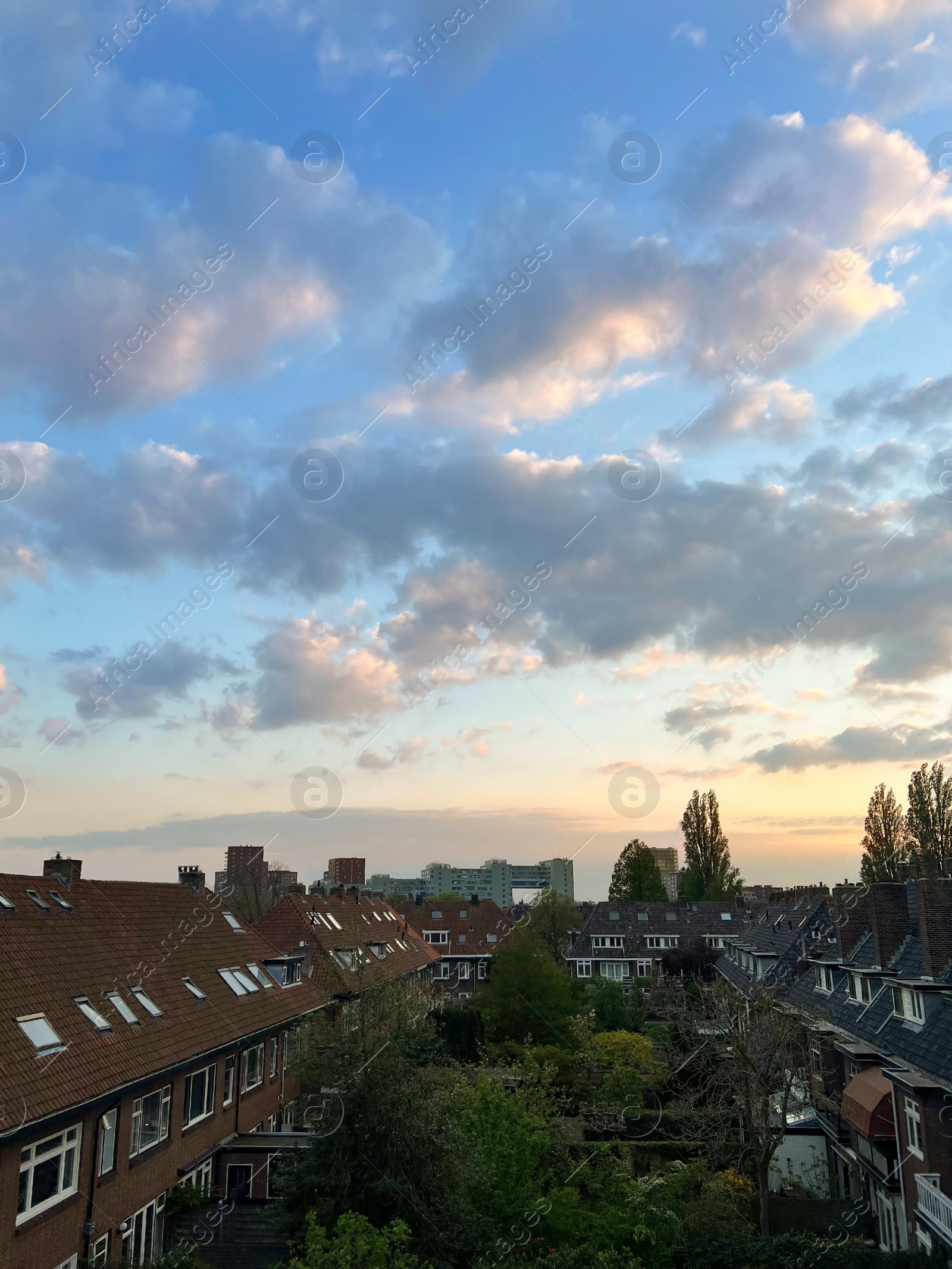 Photo of Residential complex with cozy inner yards under beautiful cloudy evening sky