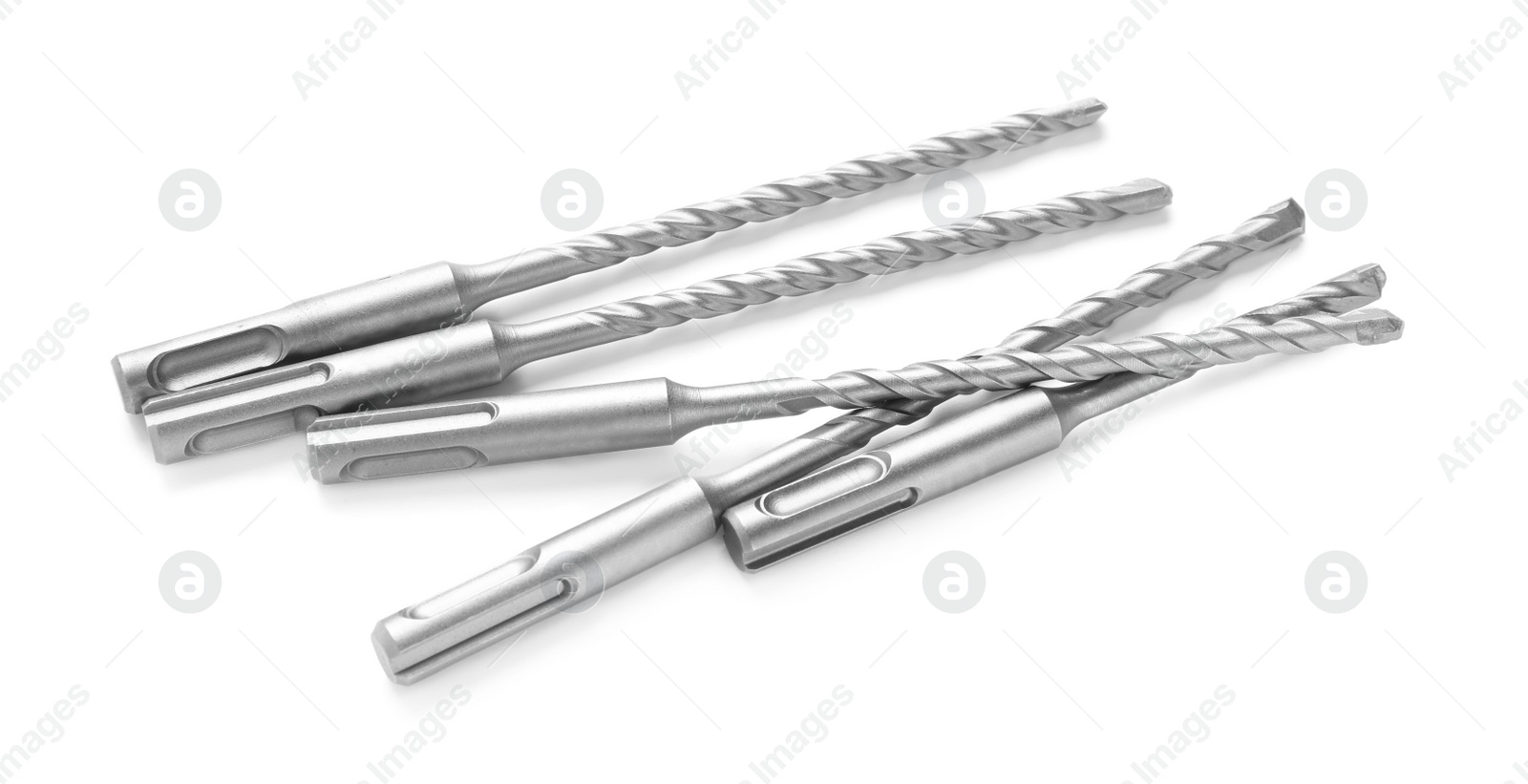 Photo of Many twist drill bits isolated on white. Carpenter's tools