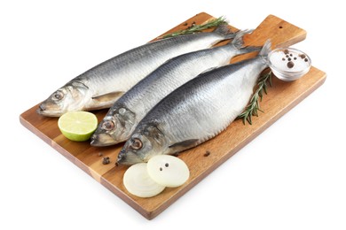 Photo of Wooden board with salted herrings, onion, lime, spices and rosemary isolated on white