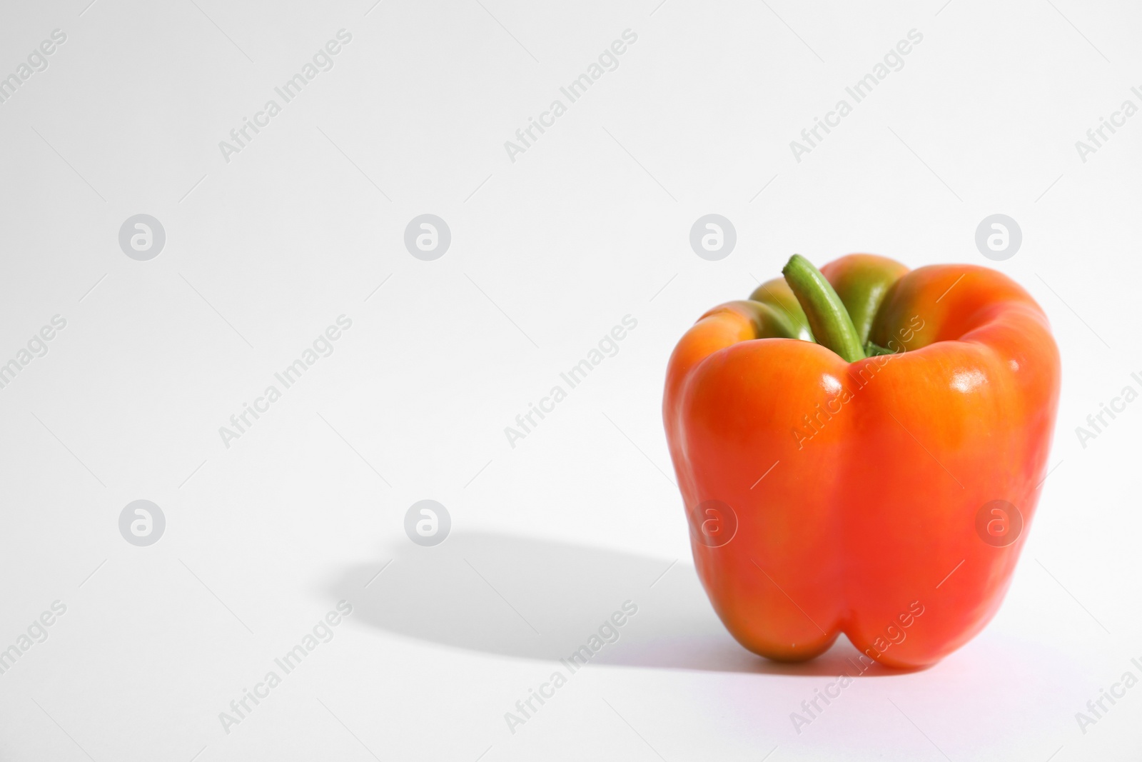 Photo of Raw ripe paprika pepper on white background