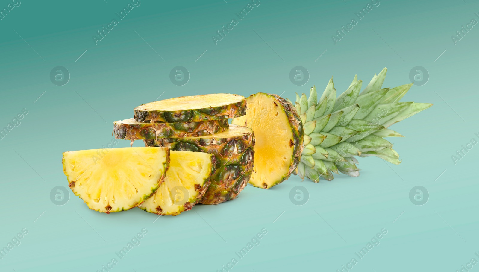 Image of Cut fresh juicy pineapple on turquoise background