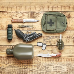 Photo of Set of military equipment on wooden background, flat lay