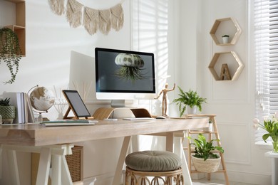 Photo of Stylish home office interior with comfortable workplace