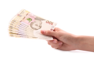 Woman holding Ukrainian money on white background, closeup