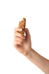 Photo of Woman holding grain cereal bar on white background. Healthy snack