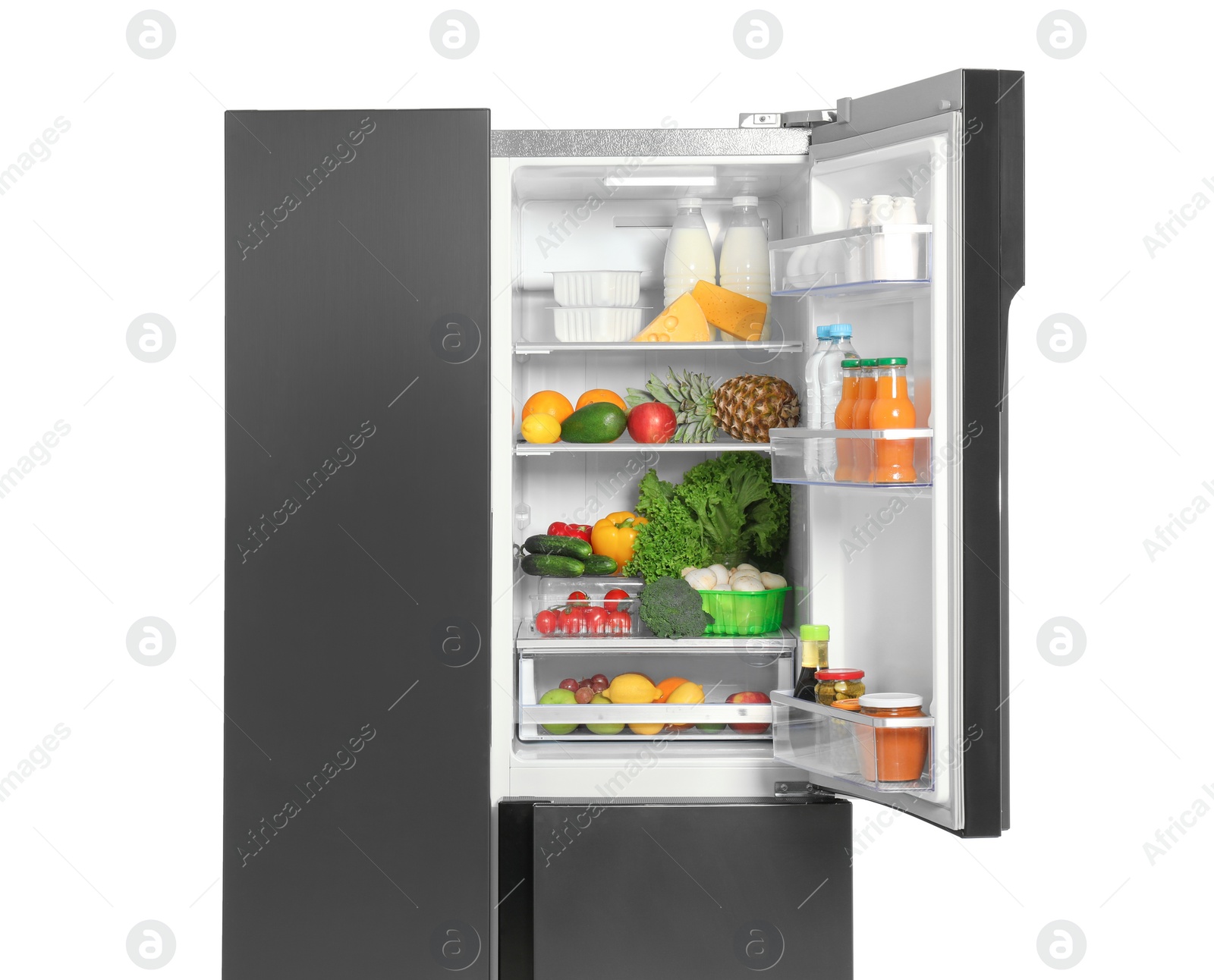Photo of Open refrigerator full of different products isolated on white