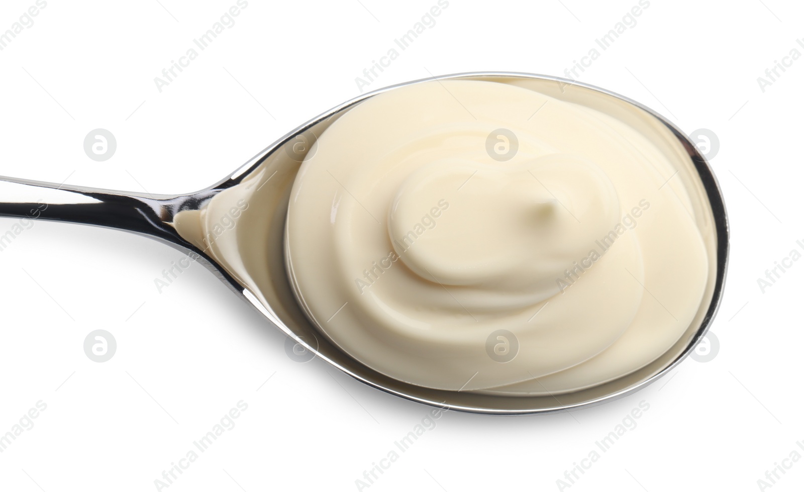 Photo of Natural yogurt in spoon isolated on white, top view