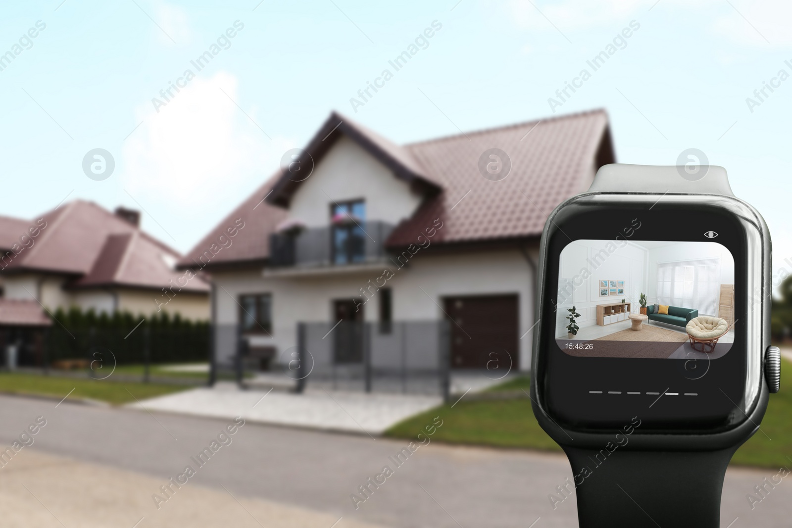 Image of Home security system. Modern smartwatch with image of room through CCTV camera on display against house, collage design