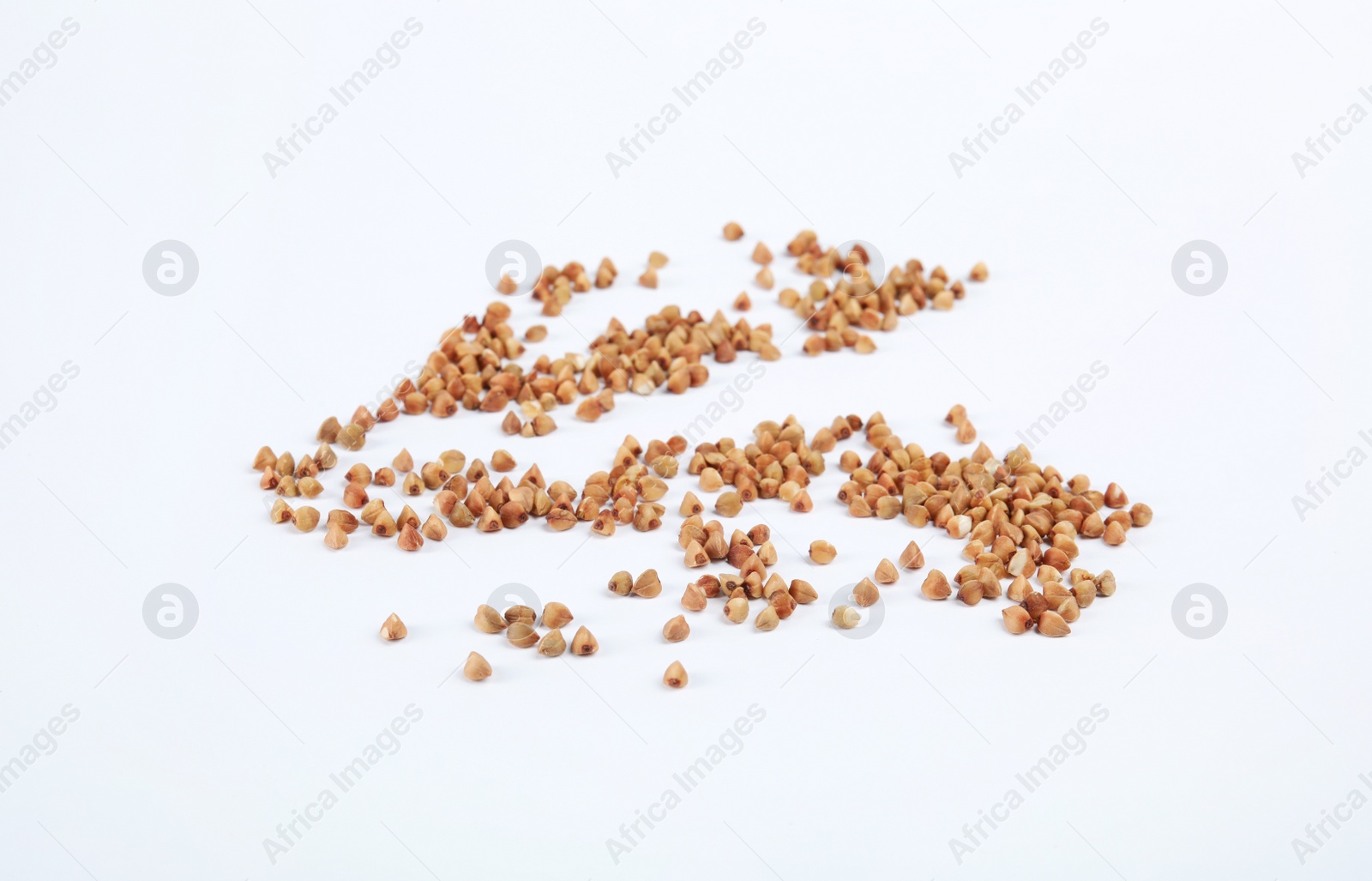 Photo of Uncooked buckwheat on white background. Healthy diet