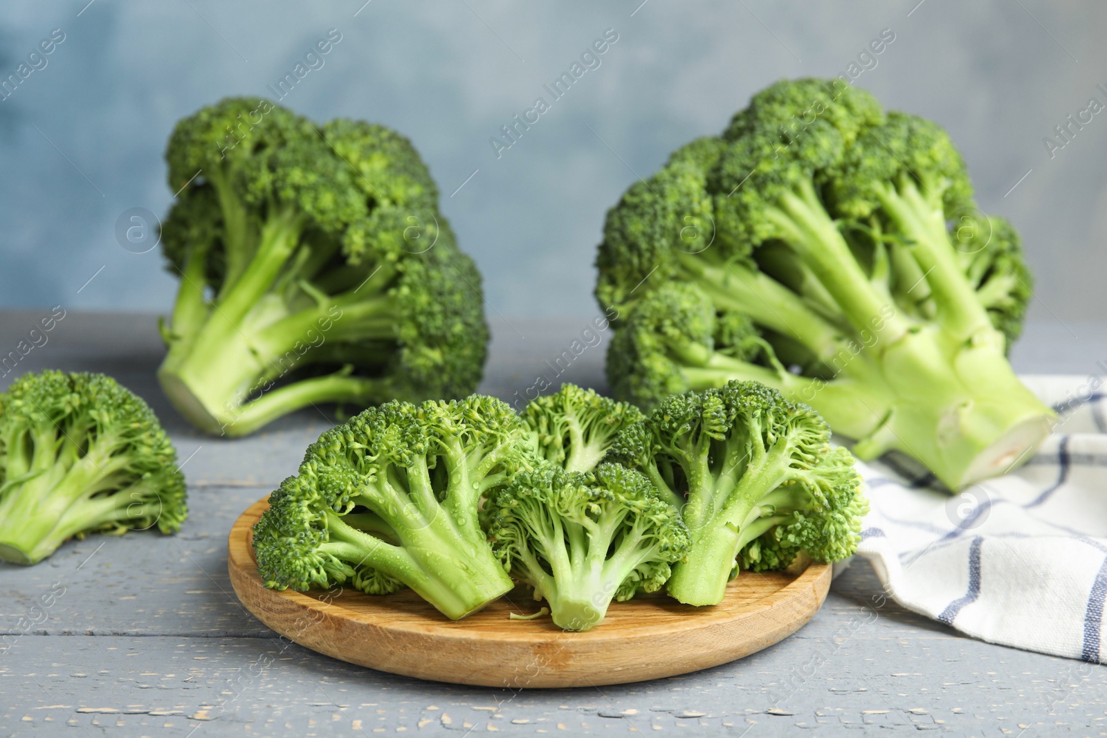 Photo of Fresh green broccoli on wooden table. Organic food