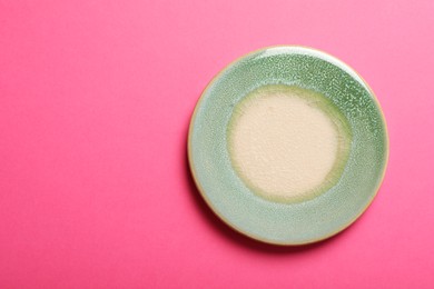 Stylish cup coaster on pink background, top view. Space for text