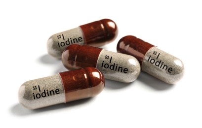 Iodine capsules on white background. Mineral element