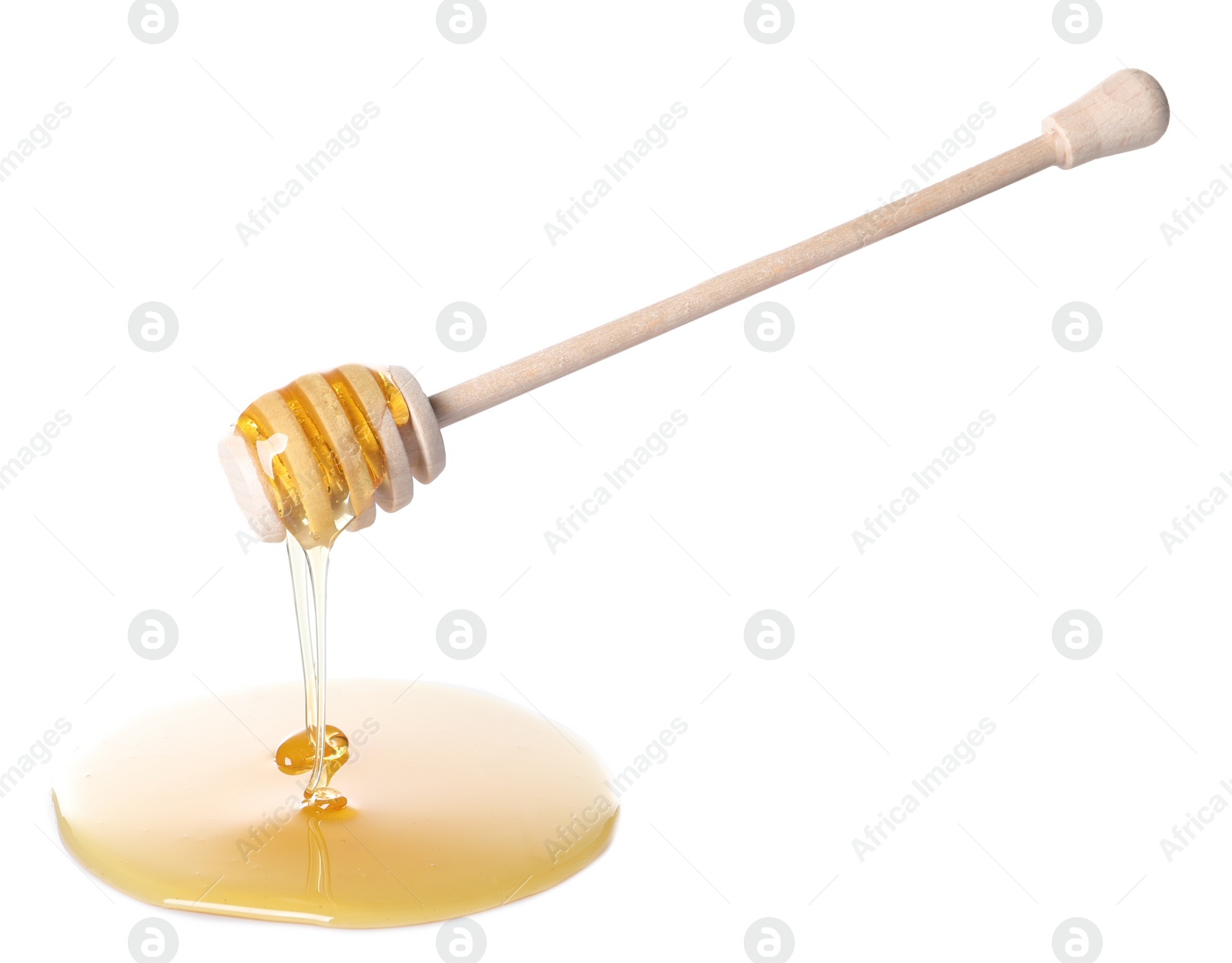 Photo of Fresh honey dripping from dipper on white background