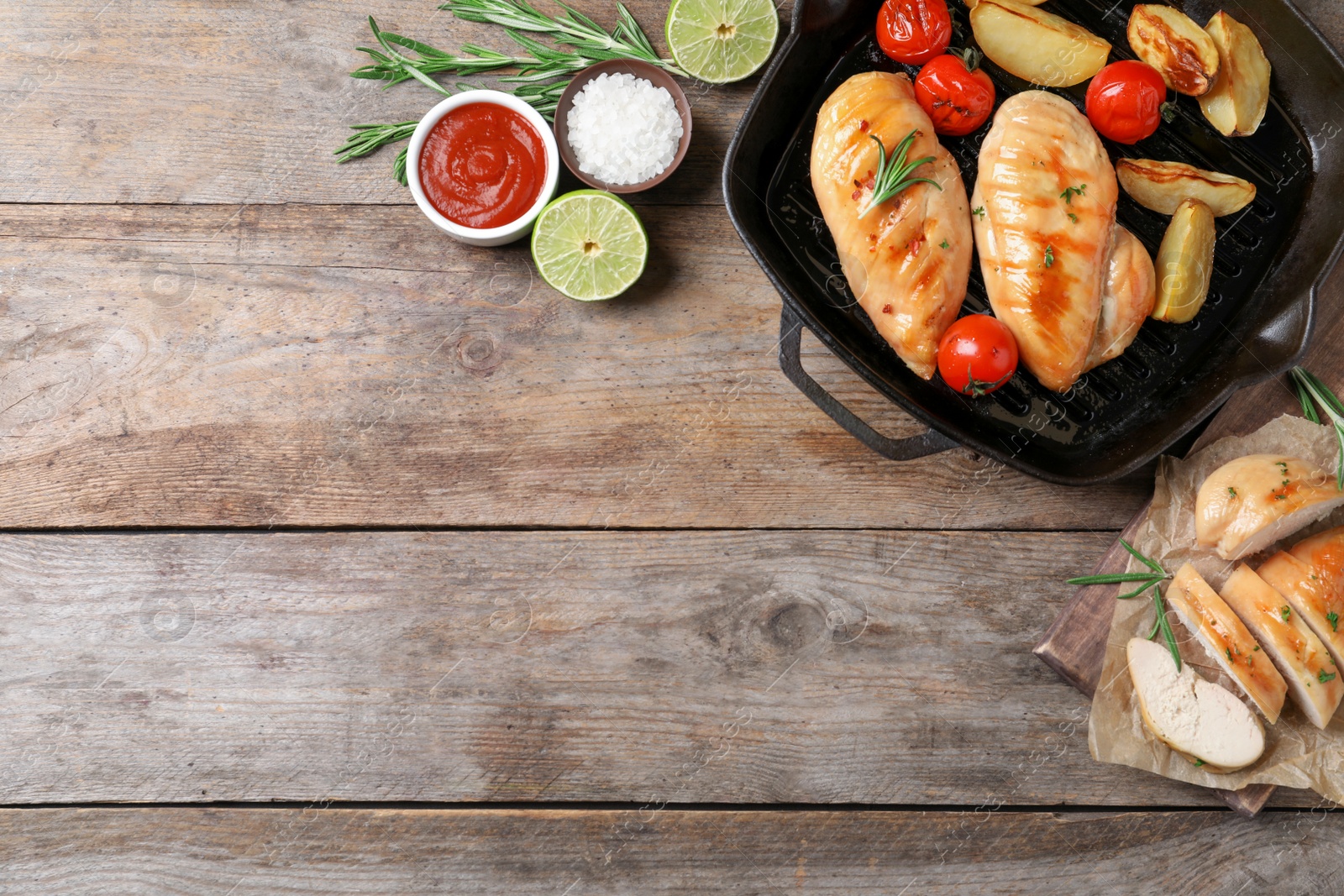 Photo of Flat lay composition with fried chicken breasts and space for text on wooden background