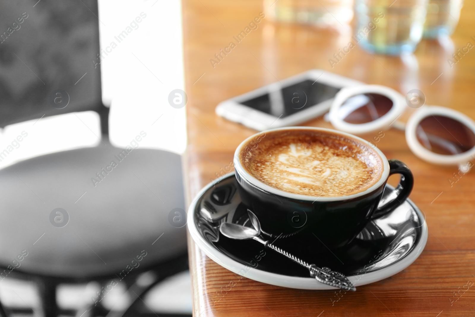 Photo of Cup of fresh aromatic coffee on table