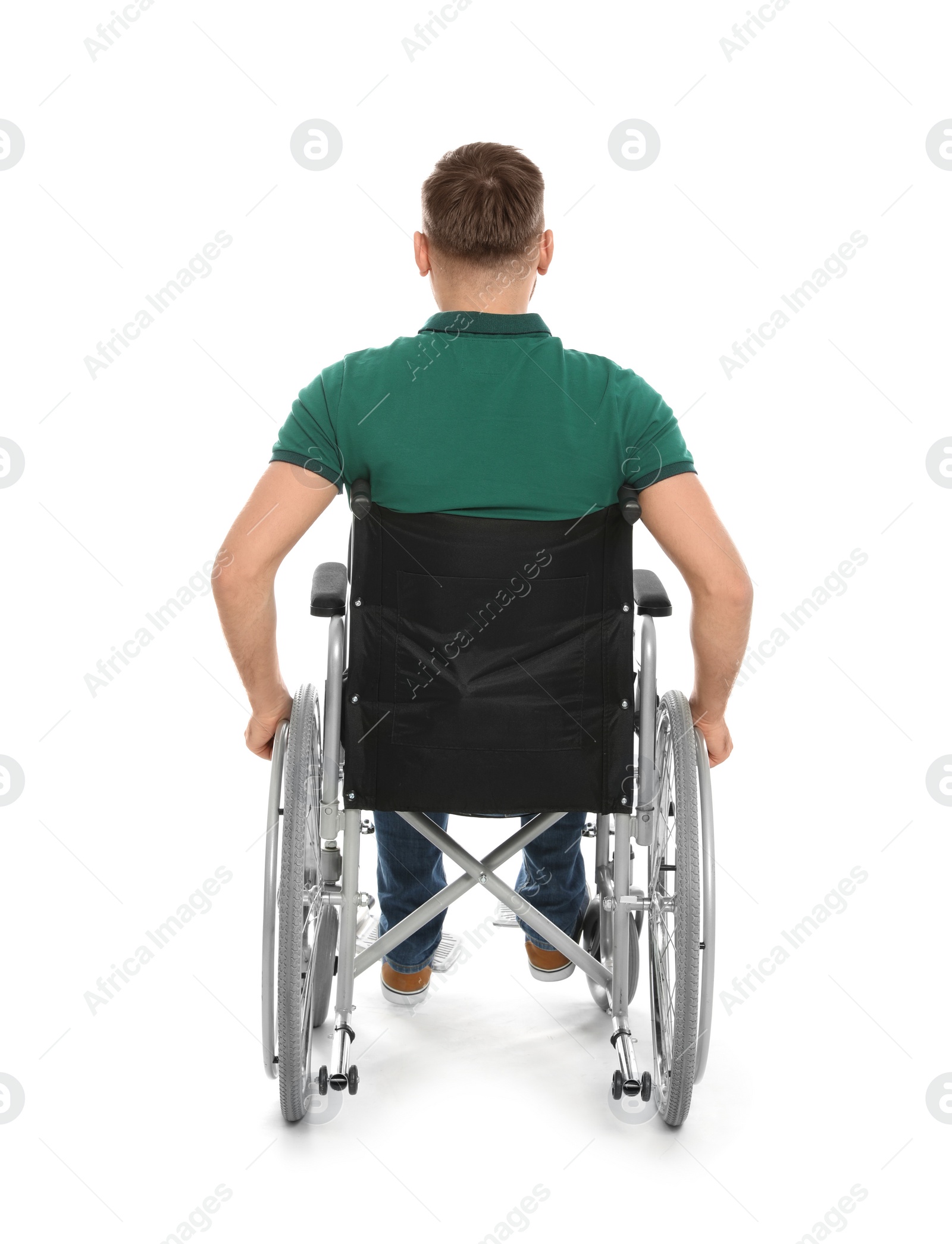 Photo of Handsome young man in wheelchair isolated on white