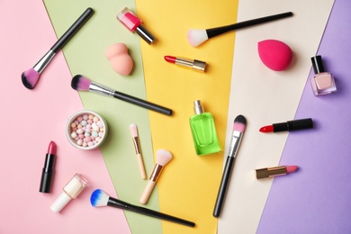 Photo of Flat lay composition with cosmetic products on color background