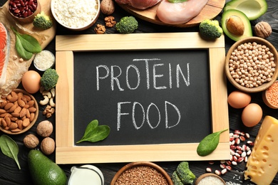 Photo of Chalkboard with written text Protein Food among natural products, top view