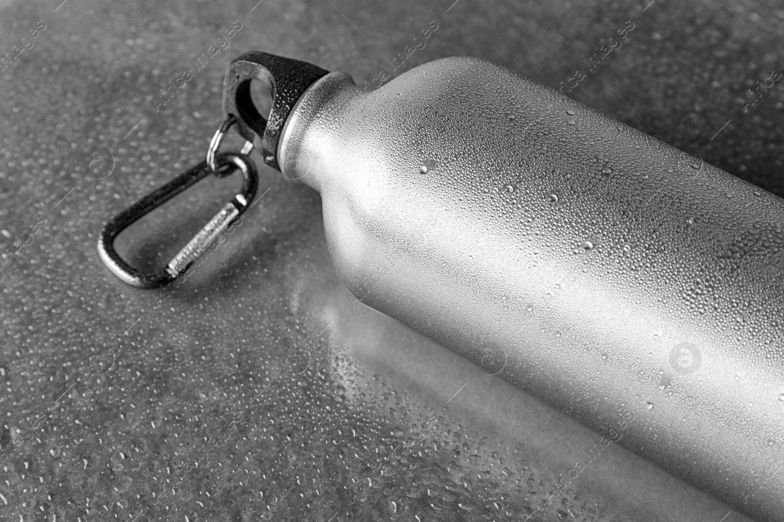 Photo of Aluminum sports water bottle on gray background