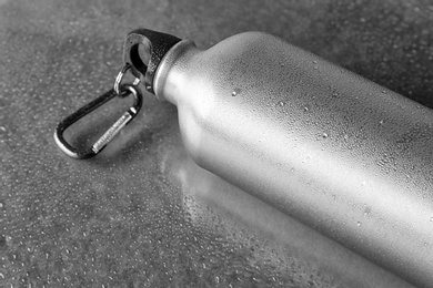 Aluminum sports water bottle on gray background