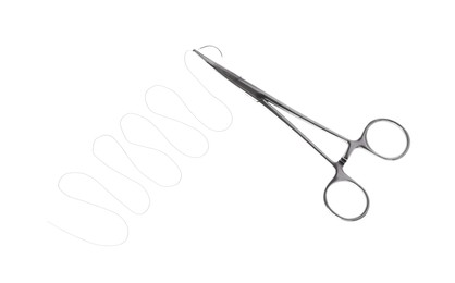 Photo of Forceps with suture thread on white background, top view. Medical equipment