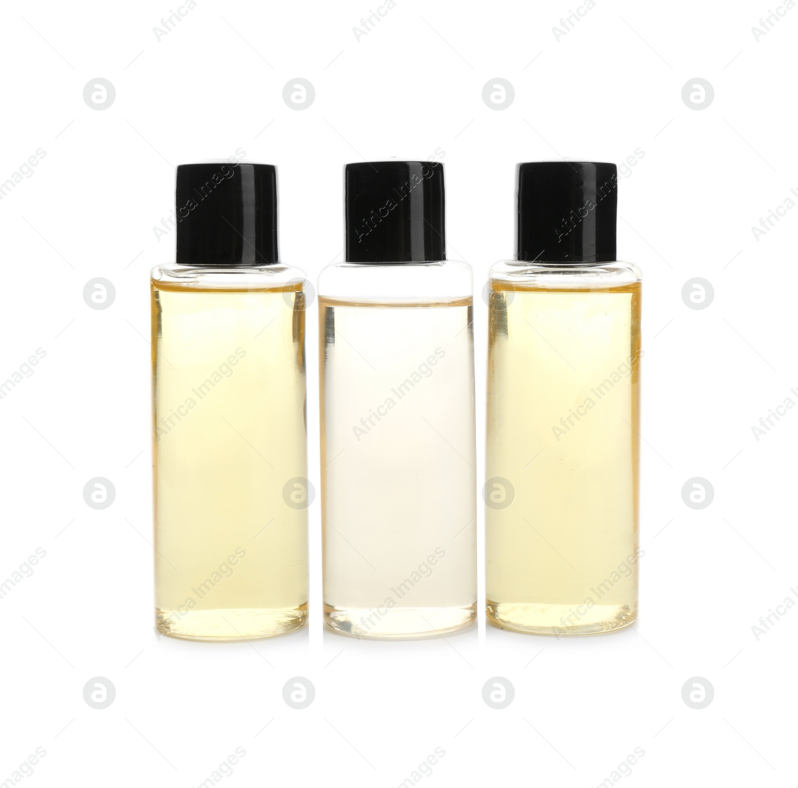 Photo of Mini bottles with cosmetic products on white background. Hotel amenities