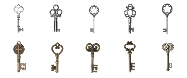 Image of Set of different ornate keys on white background. Banner design