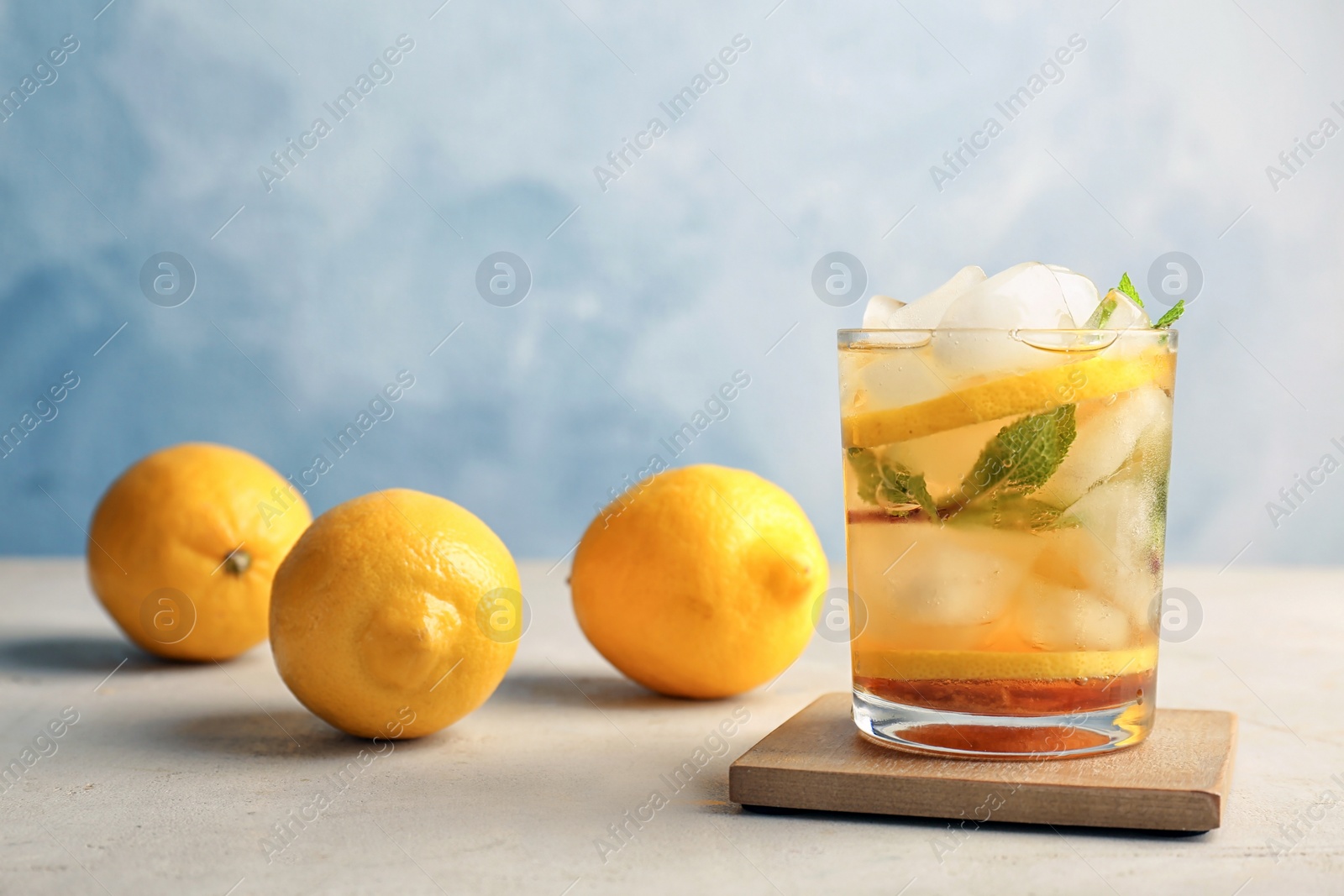 Photo of Glass of delicious mint julep cocktail on table