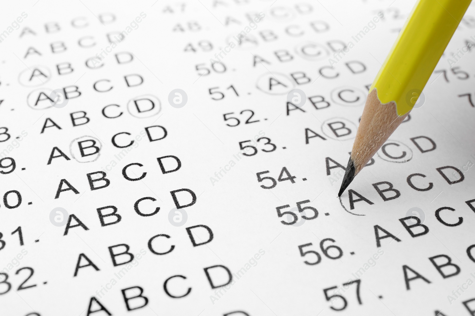 Photo of Filling answer sheet with pencil, closeup view