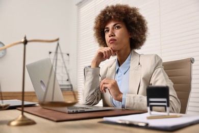 Notary with glasses at workplace in office