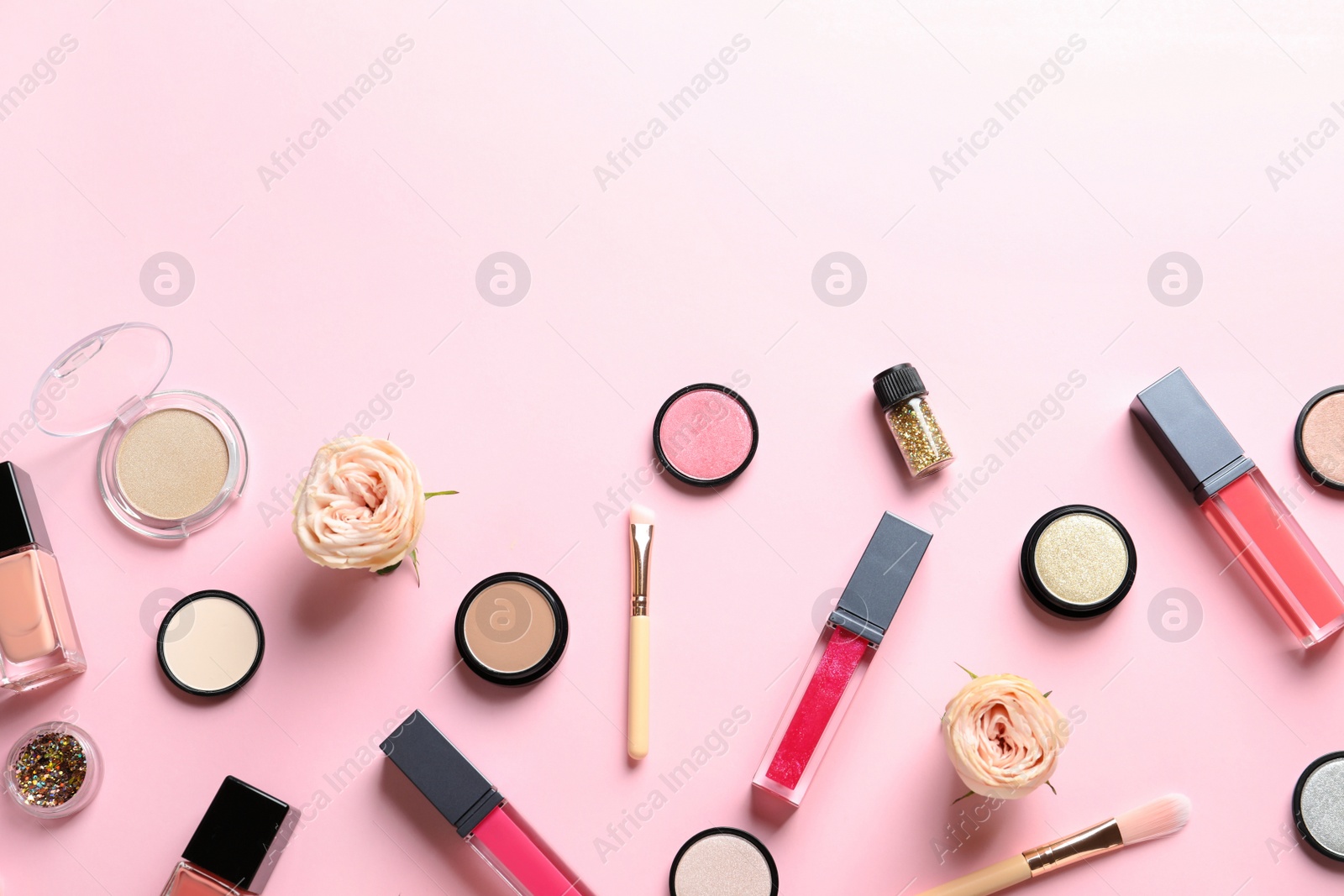 Photo of Beautiful composition with lipsticks and flowers on color background, flat lay