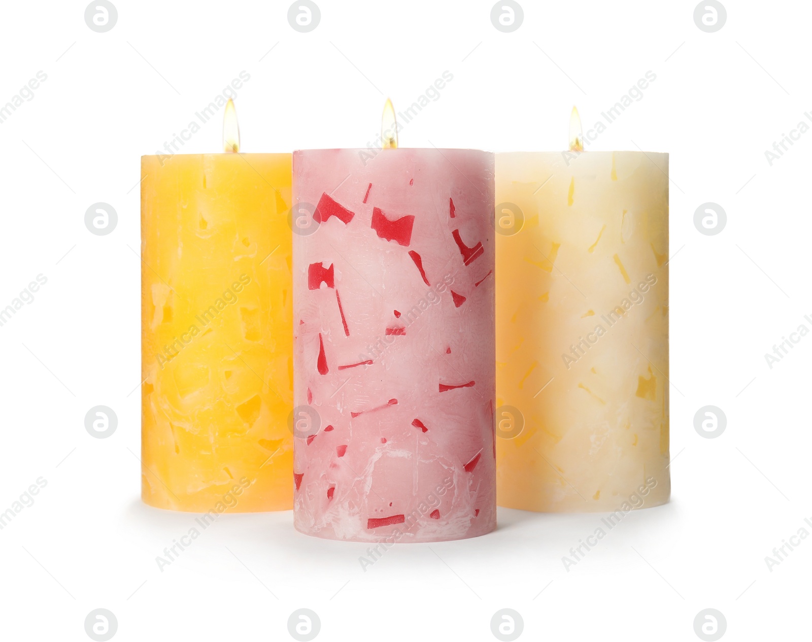 Photo of Alight color wax candles on white background