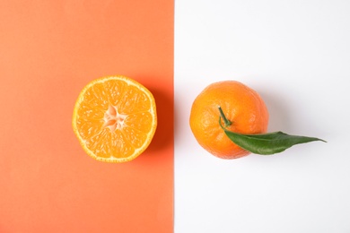 Photo of Flat lay composition with ripe tangerines on color background